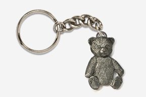 A silver bear keychain is hanging on a chain.