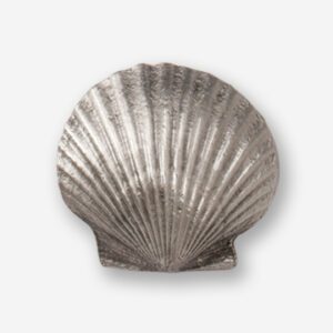 A silver shell shaped object with no background.