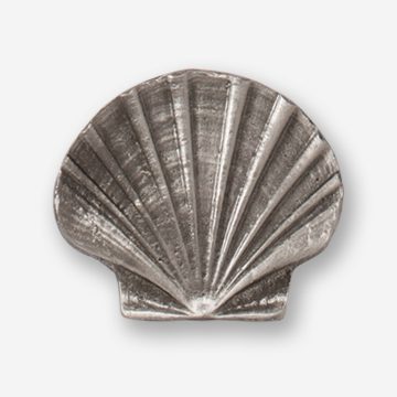 A silver shell shaped object with no background.