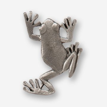 A silver frog pin with its legs crossed.