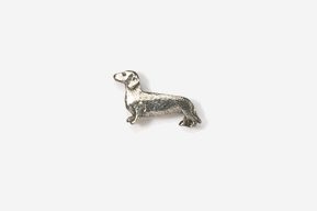 A silver dachshund dog pin is shown here.