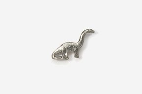 A silver dinosaur sitting on top of a white surface.