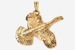 A gold goose pendant with its wings spread.