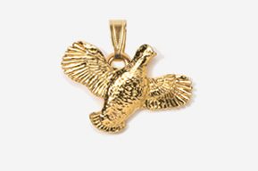 A gold pendant of a bird with its wings spread.