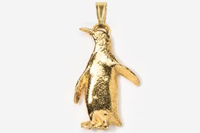 A gold penguin with its baby in it's mouth.