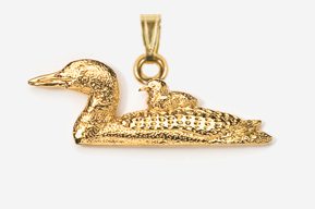 A gold plated duck with a baby bird on it.