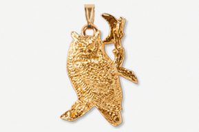 A gold owl with branch on it's back.