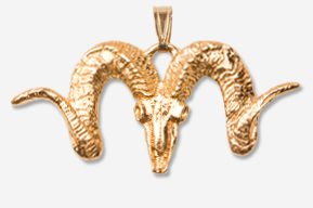 A gold ram head with horns on top of it.