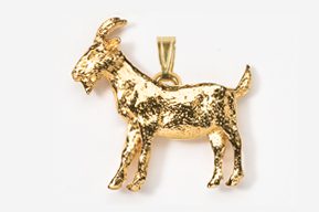 A gold goat is standing in the middle of a field.