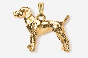 A gold plated dog pendant with a chain.