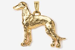 A gold plated dog pendant with a chain.