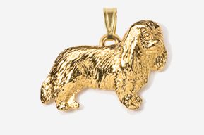 A gold plated dog pendant is shown.