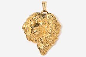 A gold leaf pendant is shown in this picture.