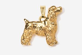 A gold plated dog pendant is shown.