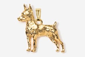 A gold dog pendant is shown in this picture.