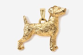 A gold dog pendant is shown in this image.