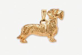 A gold plated dachshund dog pendant with chain