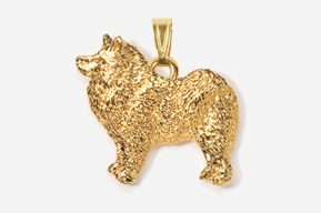 A gold colored dog pendant is shown.