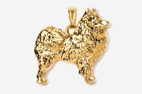 A gold plated dog pendant is shown.