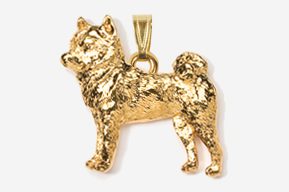 A gold colored dog pendant is shown.