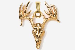 A gold deer skull with antlers hanging from the side.