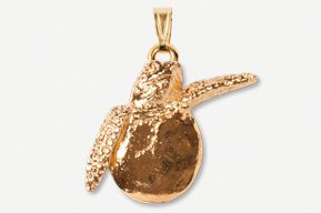 A gold plated pear shaped pendant with a diamond cut design.