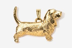 A gold plated basset hound dog pendant.