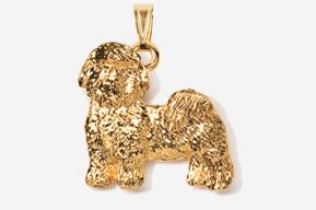 A gold colored dog pendant is shown.