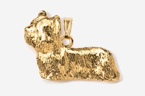 A gold plated dog pendant is shown.