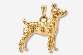 A gold plated dog pendant is shown.