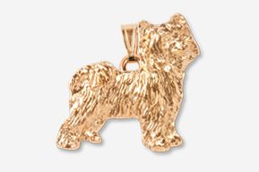 A gold dog pendant is shown in this picture.