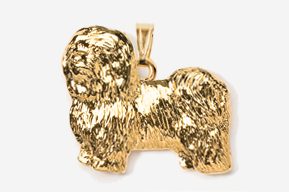 A gold colored dog pendant is shown.