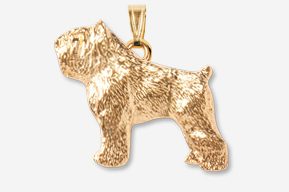 A gold colored dog pendant is shown.