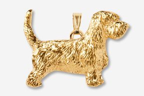 A gold plated dog pendant is shown.