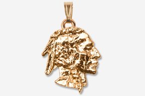 A gold pendant of a native american head.