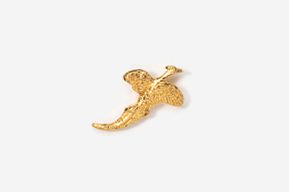 A gold plated dinosaur pin on white background.