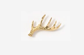 A gold antler brooch is shown on a white background.