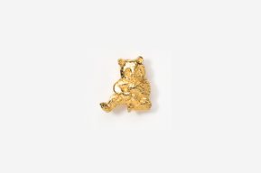 A gold colored bear with a key chain attached.