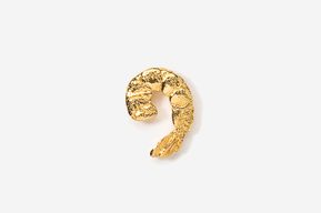 A gold piece of art that is shaped like a snake.